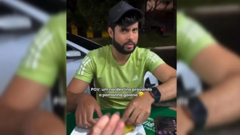 Influencer Thiago Solrac provando pamonha - (Foto: reprodução/redes sociais Isadora Duarte)