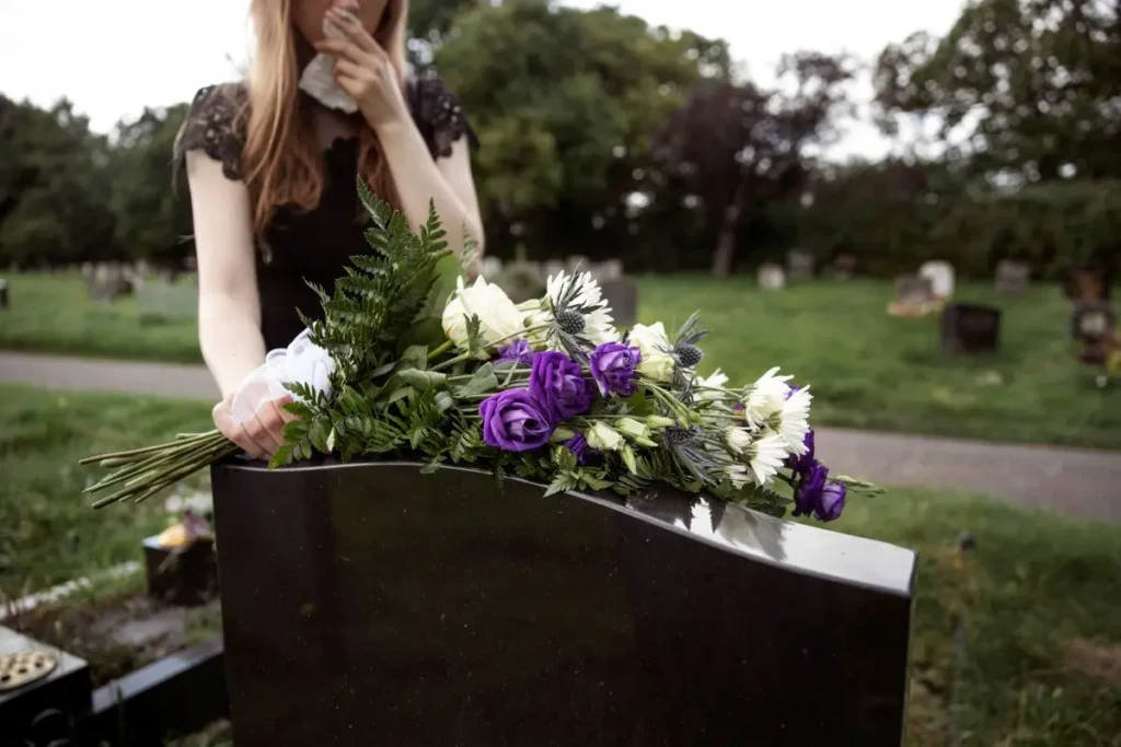 close-up-woman-visiting-grave-loved-one-1-1792787503
